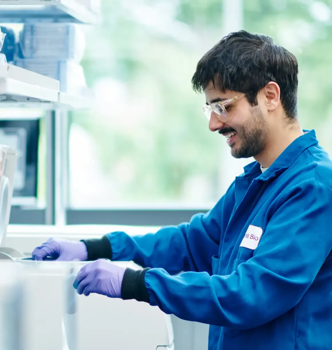 Photo of scientist smiling while working